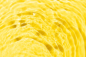 Watery waves with shining swirl texture on a vibrant yellow background. Abstract background idea....