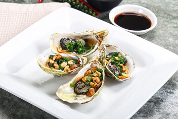 Open half oysters with green onion