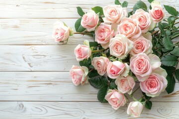 Bouquet of beautiful pink roses on a white wooden background with copy space for text, Top view, wedding, anniversary, birthday, valentine, easter, summer, spring banner
