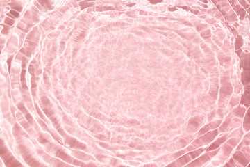 Flowing water with shining wave texture on a vibrant sunlight pink background.  Abstarct colours...