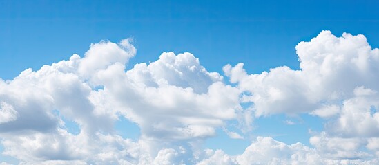 Blue sky background and white clouds soft focus and copy space horizontal shape