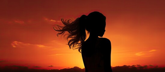 Fototapeta premium Silhouette of girl at sunset. Creative banner. Copyspace image