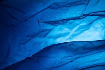 Extreme close up of blue empty plastic bag background.