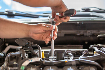Combustion engine vehicle maintenance, replace of spark plugs