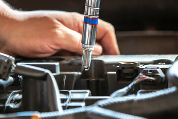 Combustion engine vehicle maintenance, replace of spark plugs