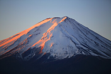 peak of fuji mountain in Kawaguchi with high amount of snow falling in winter