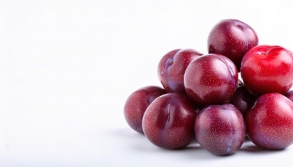 Obraz premium plum is a purple fruit of some species in Prunus sp. dried versions are called prunes. They may have been one of the first fruits domesticated by humans. Isolated on white background