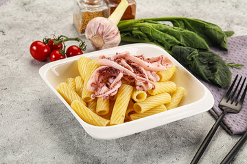 Italian cuisine - pasta tortiglioni with squid