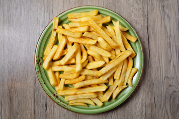 French fries served on plate on table