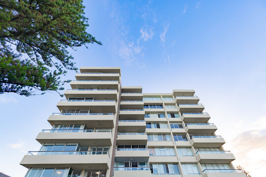 Modern white apartment building with copy space