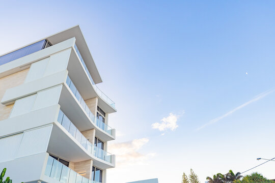 Modern white apartment building with copy space