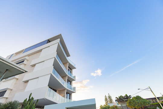 Modern white apartment building with copy space
