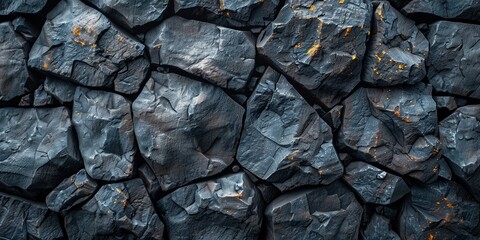 A rough, textured stone wall, weathered and aged, creates an abstract backdrop of vintage architecture.