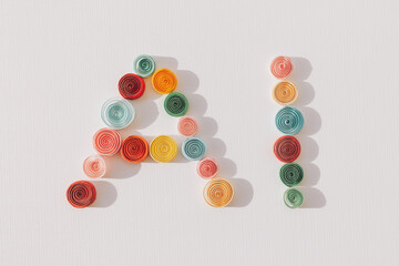 Creativity. Letters AI made of colored paper quilling circles on white background. Word AI or Artificial Intelligence concept, written with quilled paper circles. tech concept. top view