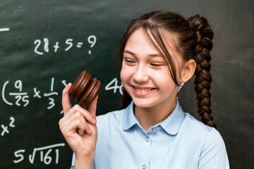 Sweet moment: Schoolgirl enjoys chocolate muffin in a fun photo.