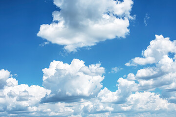 
White cumulus clouds on a blue sky on a summer day.