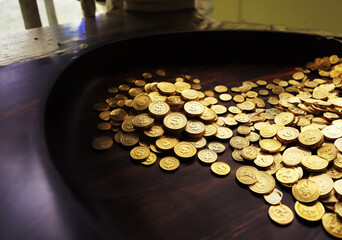 Coins spilling from a treasure chest.