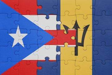 puzzle with the colourful national flag of barbados and flag of puerto rico .
