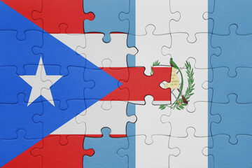 puzzle with the colourful national flag of guatemala and flag of puerto rico .