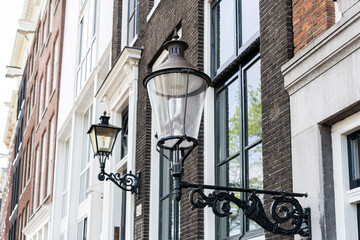 Old fashioned street lamp at night. Brightly lit street lamps at sunset. Decorative lamps. Magic...