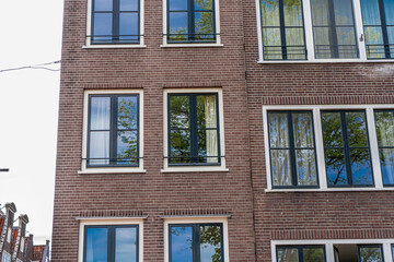 Amsterdam downtown old houses. Nice view of the famous city of Amsterdam. Travel to Europe. Amsterdam, Holland, Netherlands, Europe.