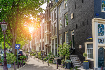 Amsterdam downtown old houses. Nice view of the famous city of Amsterdam. Travel to Europe. Amsterdam, Holland, Netherlands, Europe.