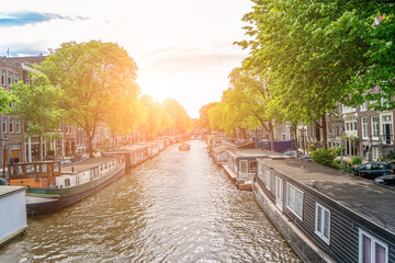 Fototapeta premium Panoramic autumn view of Amsterdam city. Famous Dutch channels and great cityscape. Colorful morning scene of Netherlands, Europe. Traveling concept background.
