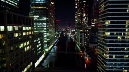 Isle of Dogs, London, UK Aerial night video of Canary Wharf skyscrapers