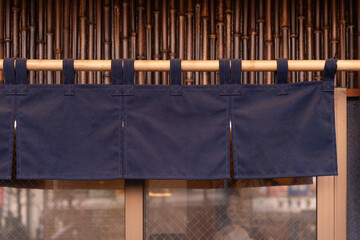 The curtain-like fabric that hangs in front of traditional Japanese restaurants and shops not only serves as a signboard, but holds a larger meaning,