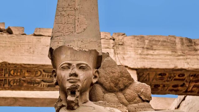 Statue of the deity Amun-Ra in the great hypostyle hall of the Karnak Temple in Luxor, Egypt