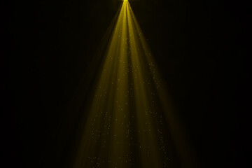 Golden spotlight rays with sparkles overlay on black background