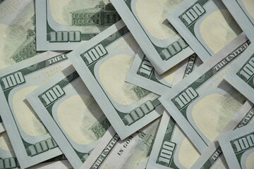 Processed collage of many US hundred dollar bills banknotes texture. Background for banner