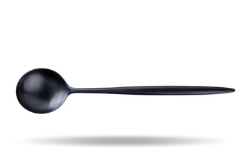 Black metal spoon on a white isolated background