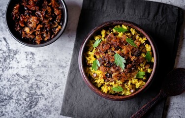 Fried onion lentil fried rice in a bowl, moujadara