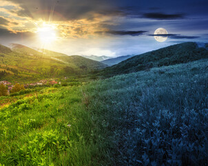 mountainous rural landscape at summer solstice. alpine countryside scenery with grassy meadows and...
