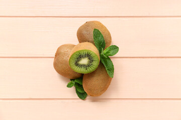 Fresh kiwi and mint on pink wooden background