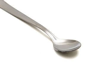 Metal large spoon in white background
