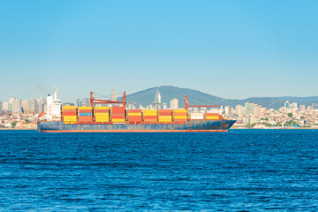 Container ship, cargo ship with many containers entering harbor port