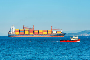 Container ship, cargo ship with many containers entering harbor port