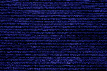 Closeup of blue-purple corduroy cloth as patterned textured background