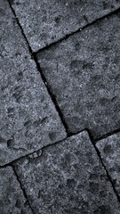 Black or dark gray rough grainy stone texture background with geometric line feature, copy space