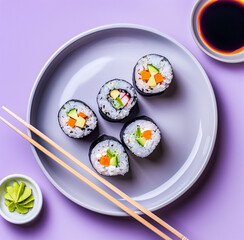 Fresh sushi rolls on a yellow background. Asian cuisine. Copy space. Top view.