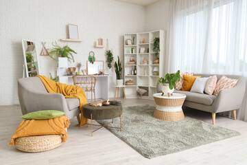 Interior of witch's room with magic attributes, sofa and armchair