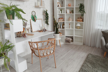 Interior of witch's room with magic attributes, table and plants