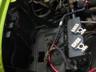 Fototapeta premium Installing New Battery Terminals for a Car Battery, Clean Electrical Work 