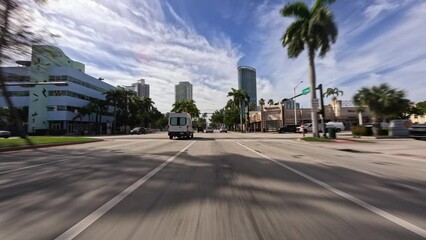 Point of view of car driving plate on Miami street architecture.  Car window view of Miami architecture during daytime