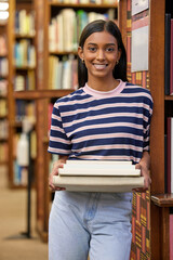Woman, college student and books in library for portrait with smile for education, development and...