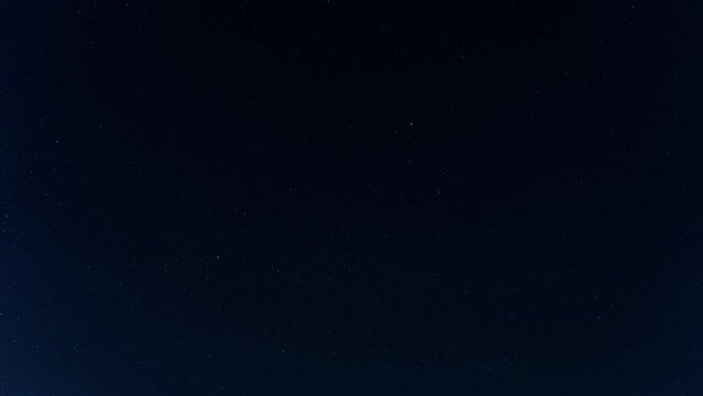 night timelapse. starry sky. starlink flying satellites