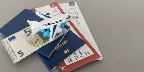 Top view of traveler accessories, passports and air tickets on background with copy space for text. Travel vacation concept