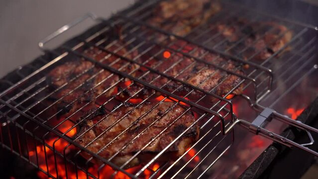 cooking meat on the grill. red charcoal. meat grill